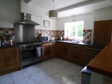 The fully fitted kitchen at The Cornflowers Holiday Home